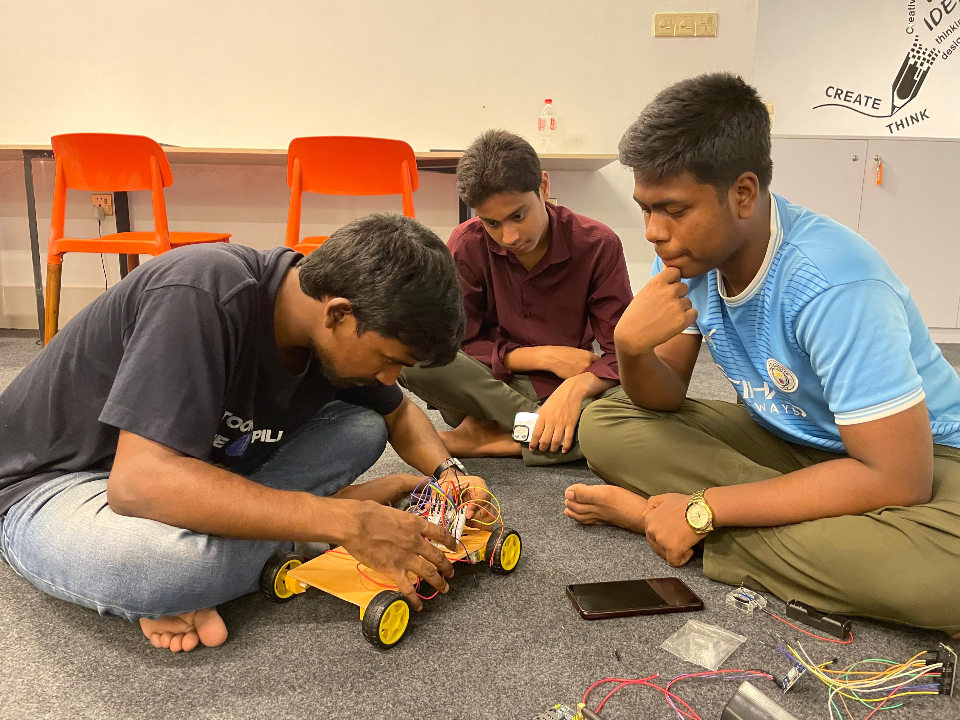 Students building a robot with real components at Witen Academy