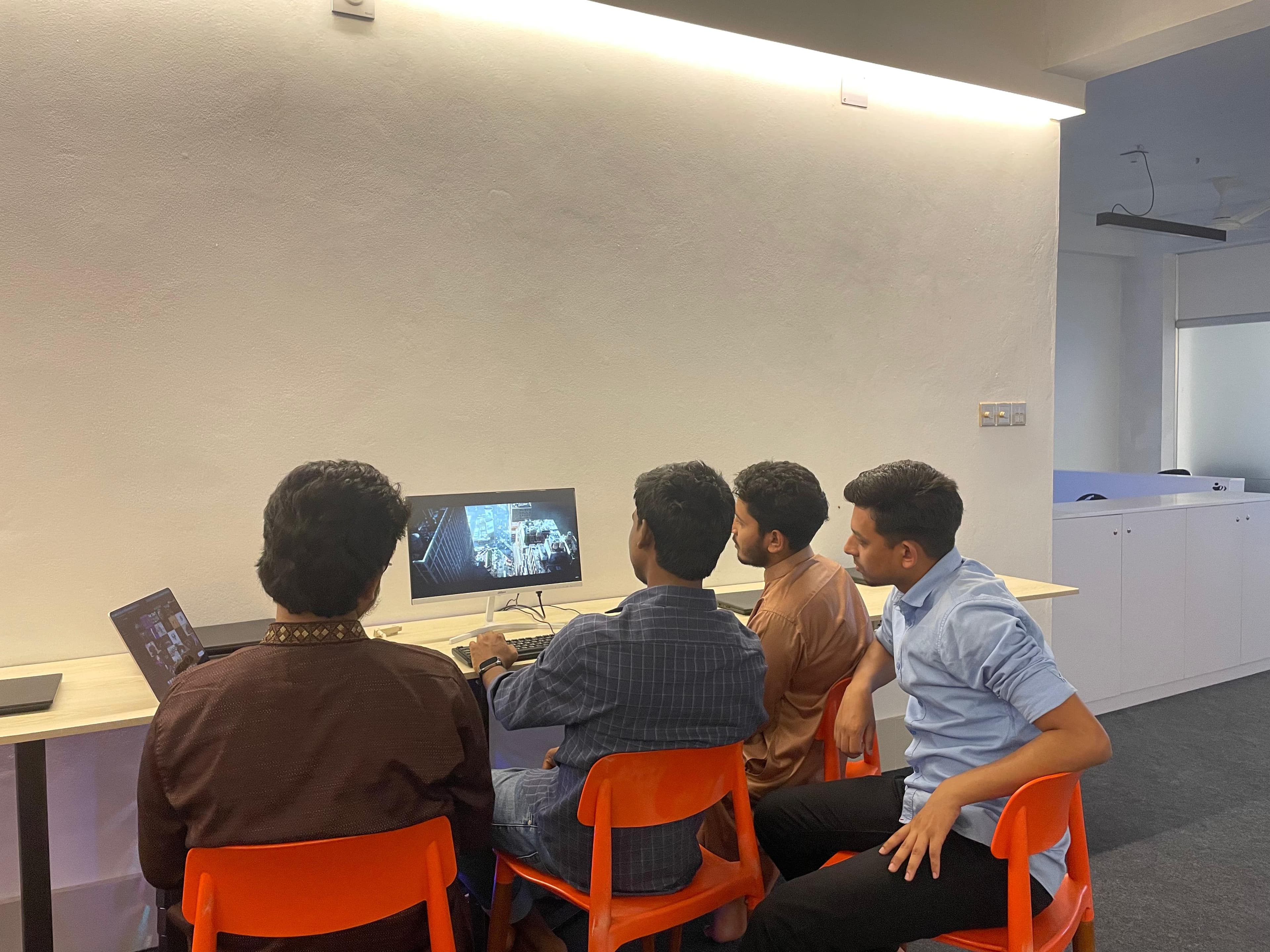 Students learning digital skills with a computer screen